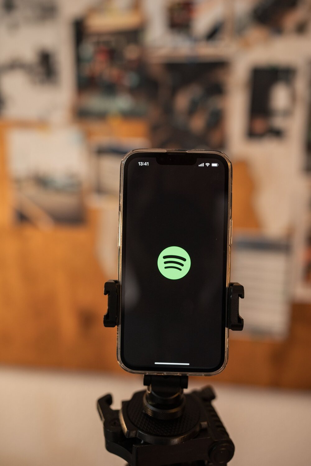 Phone displaying Spotify in a music workspace