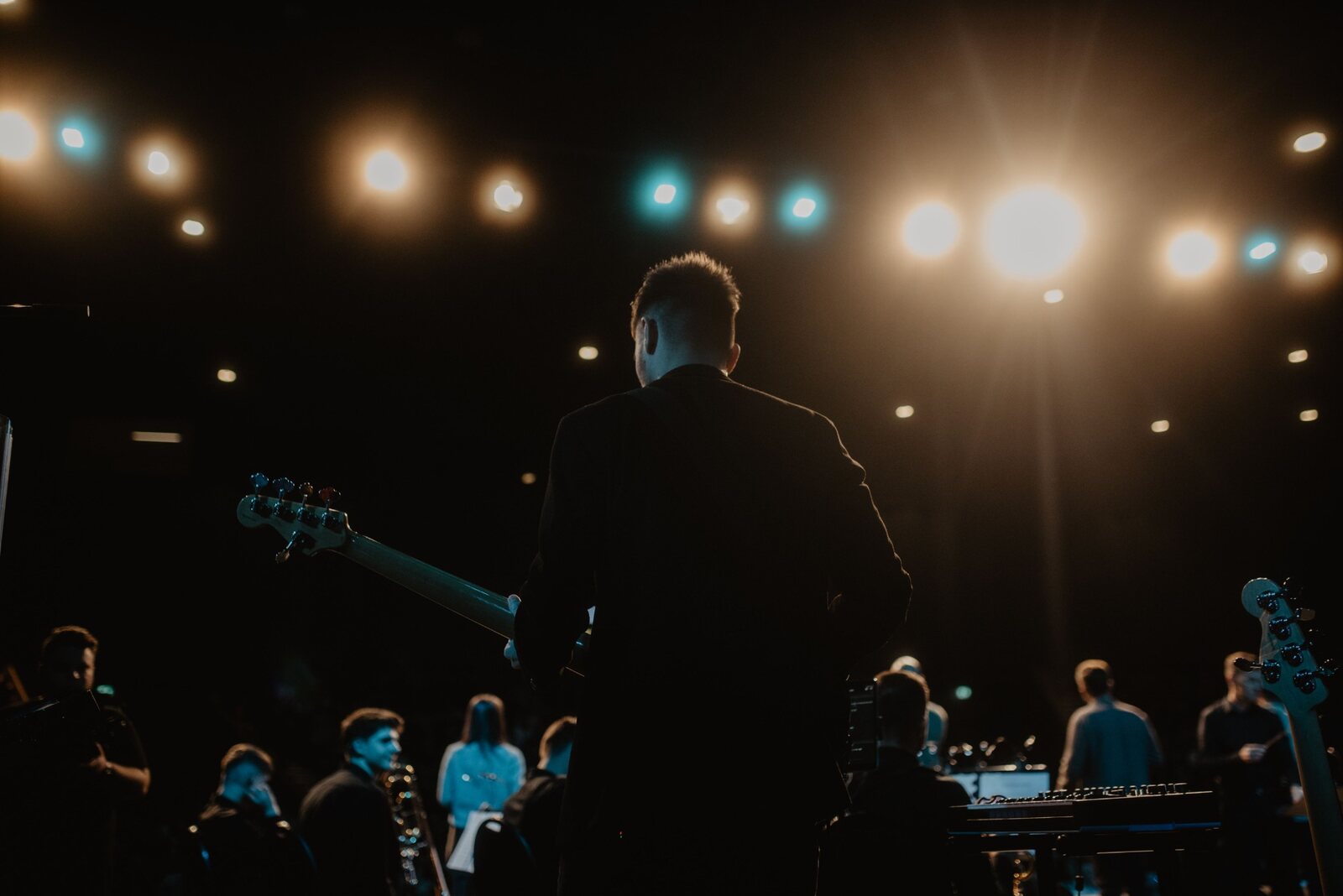 Musician on stage facing an audience
